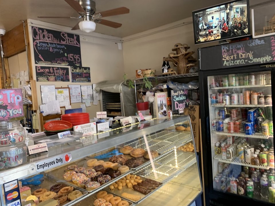 Coffee cups beside a simple lunch counter